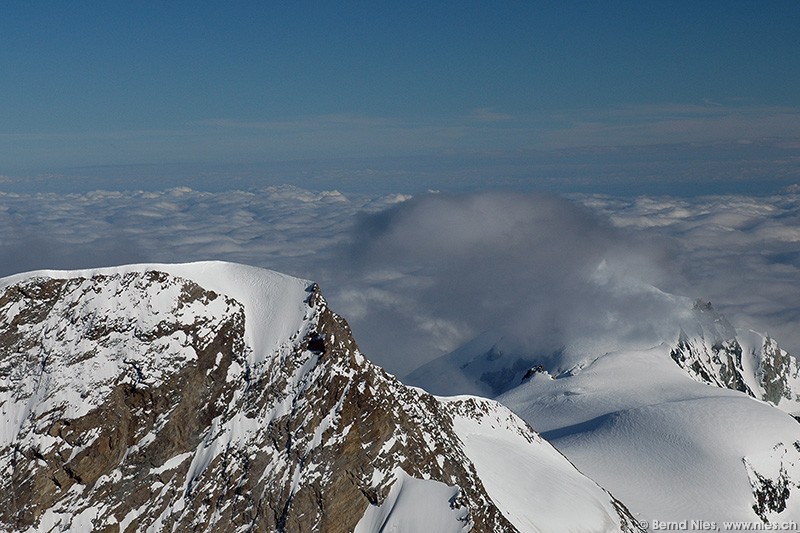 Cloud on mountain summit