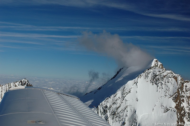 Cloud on mountain summit