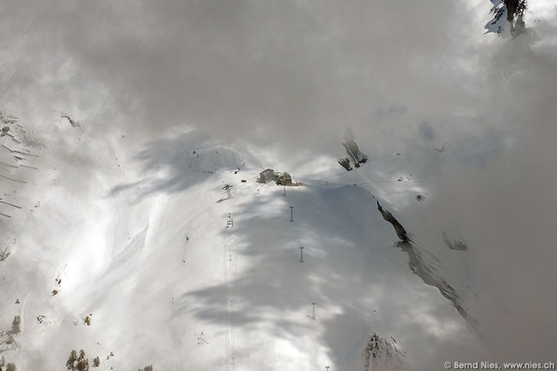 Ski lift below clouds