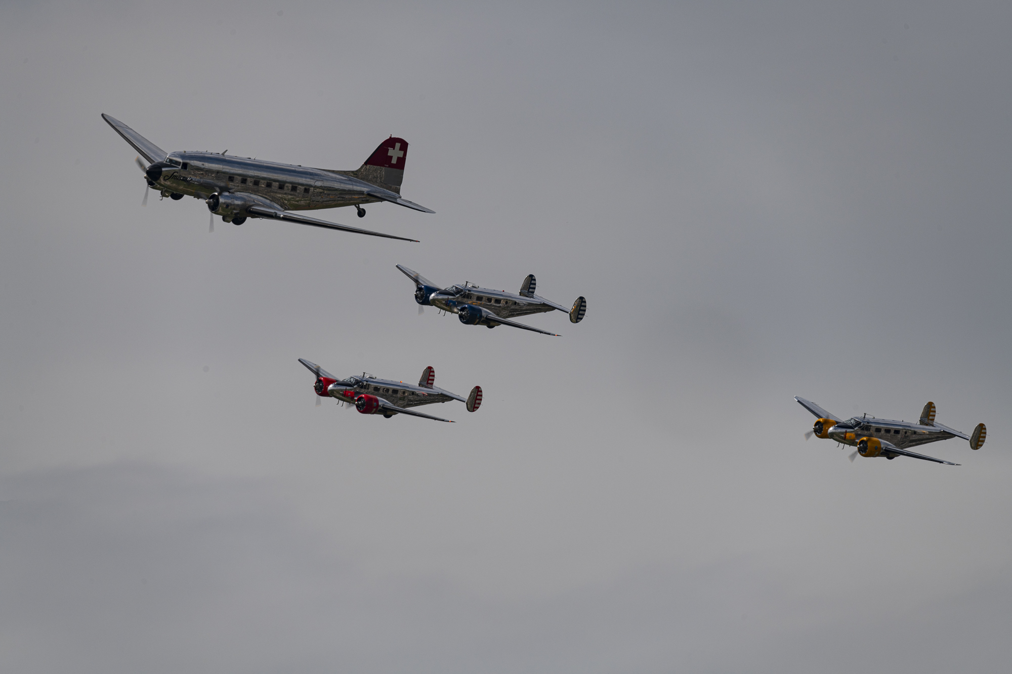 Classic Formation. Swissair Douglas DC-3 and three Beechcraft Model 18 Twin Beech.