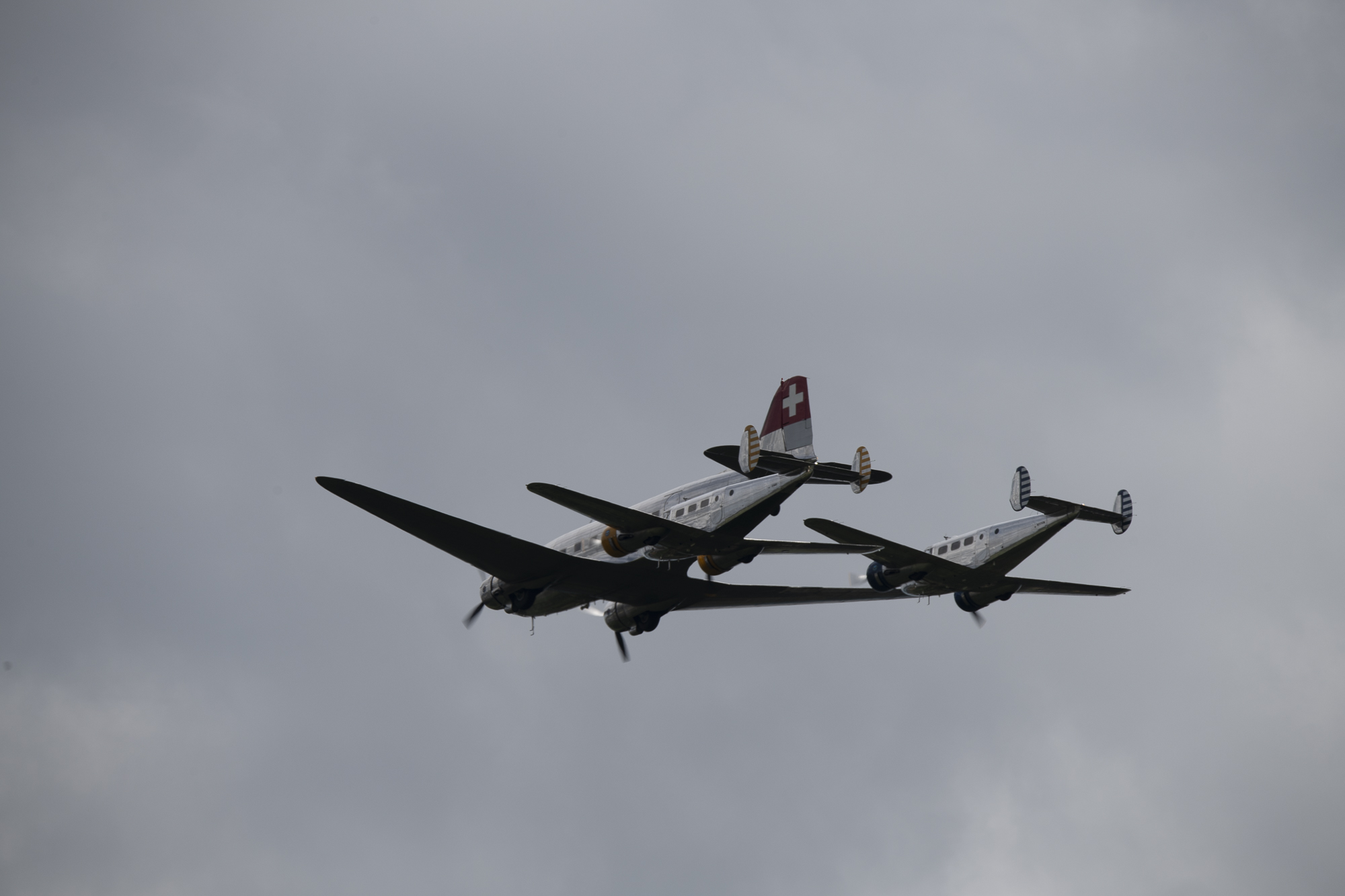 Classic Formation. Swissair Douglas DC-3 and three Beechcraft Model 18 Twin Beech.