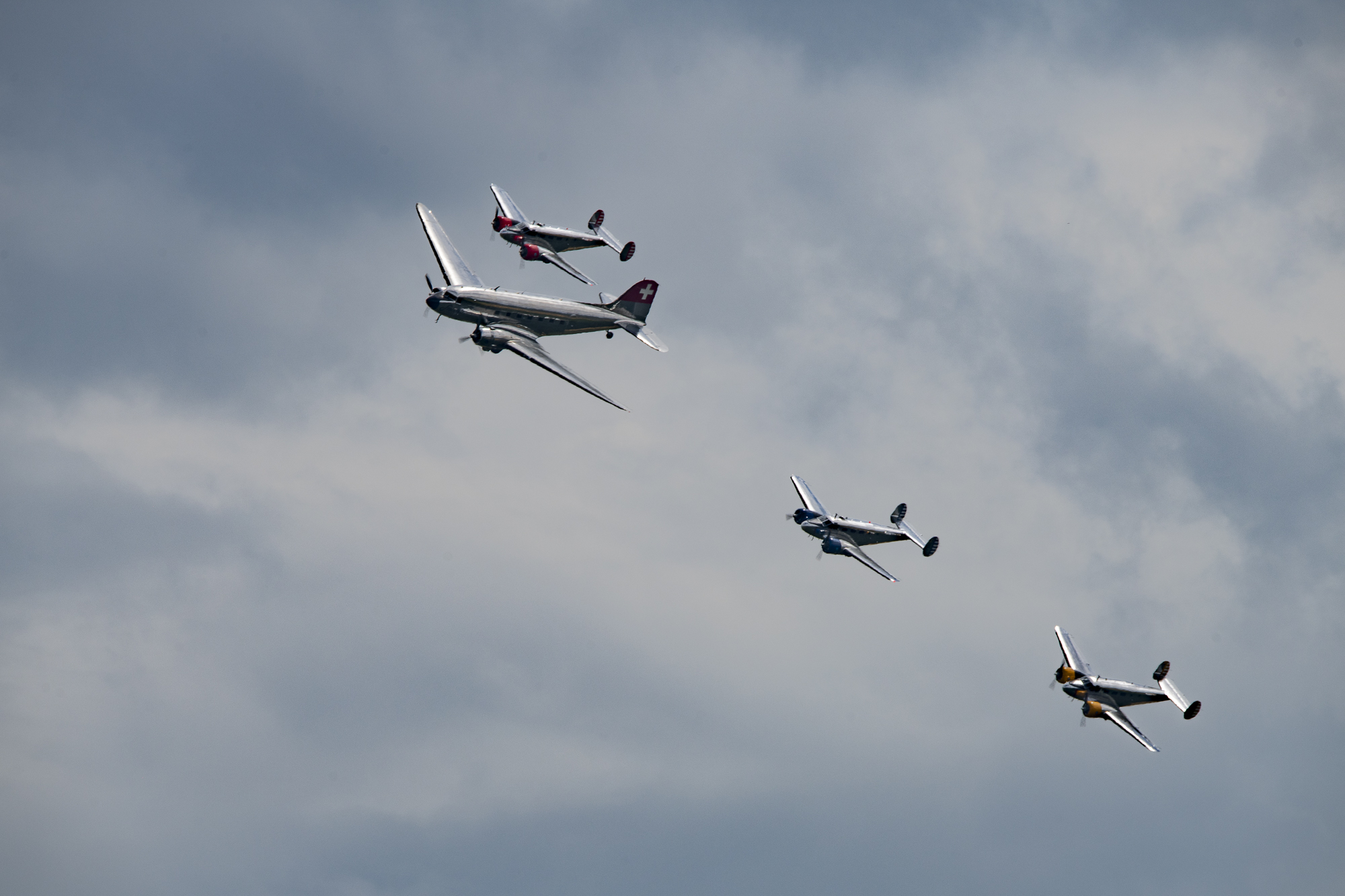 Classic Formation. Swissair Douglas DC-3 and three Beechcraft Model 18 Twin Beech.