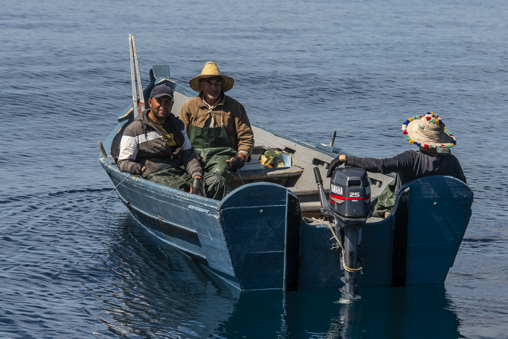 Three Moroccan fishermen in boat