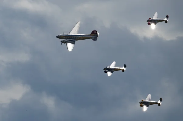 Classic Formation. Swissair Douglas DC-3 and three Beechcraft Model 18 Twin Beech.