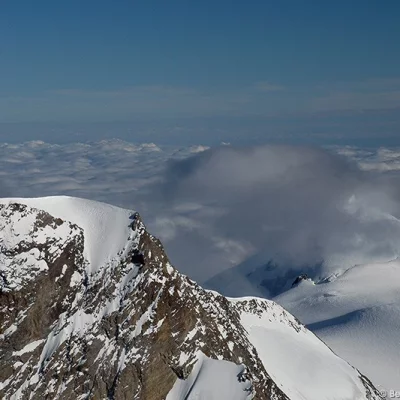 Cloud on mountain summit
