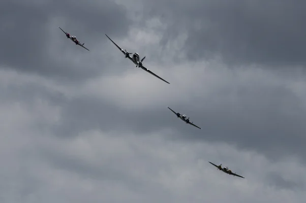 Classic Formation. Swissair Douglas DC-3 and three Beechcraft Model 18 Twin Beech.