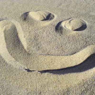 Smiley im Sand